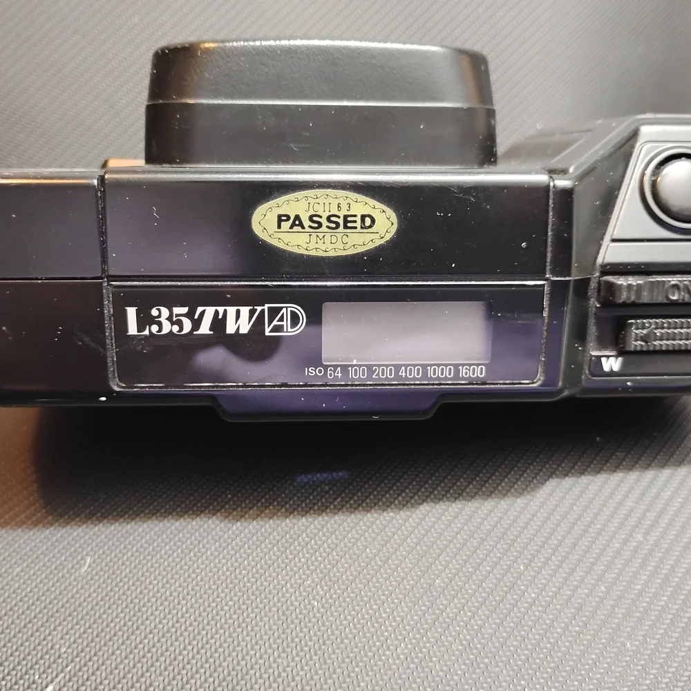 Nikon Black Camera with Gold Detail